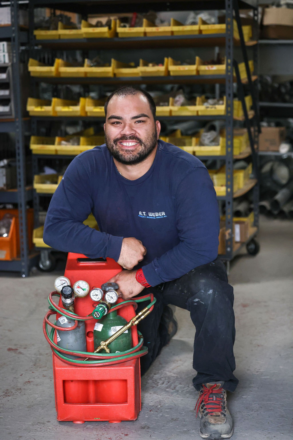 AT Weber technician with heat pump installation equipment